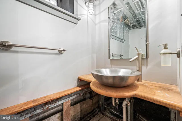 a view of a room with a table and chairs