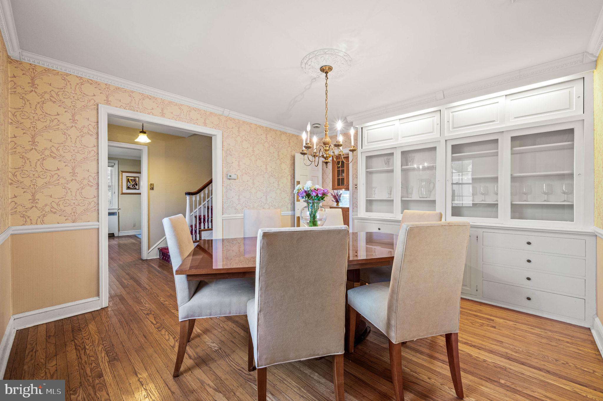 601 South Eagle Road Havertown, PA 19083 - Photo 8 of 37 a dining room with furniture a chandelier and wooden floor
