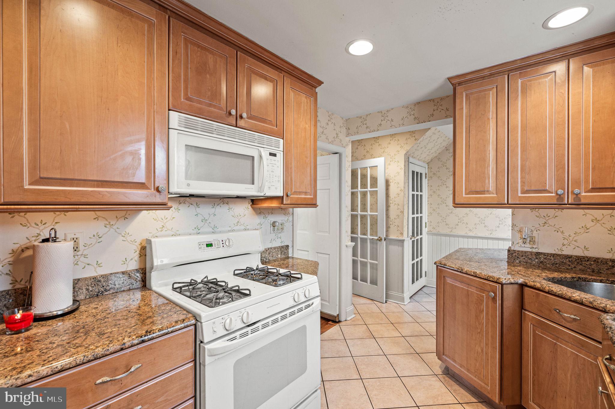 601 South Eagle Road Havertown, PA 19083 - Photo 9 of 32 a kitchen with a stove and a microwave