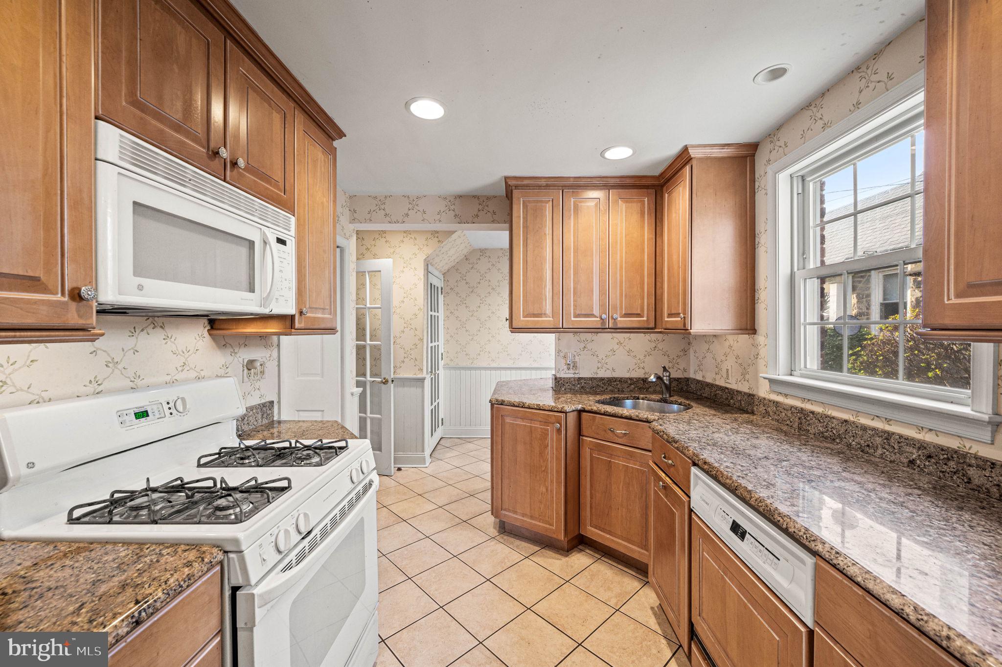 601 South Eagle Road Havertown, PA 19083 - Photo 10 of 37 a kitchen with stainless steel appliances granite countertop a stove a sink and a microwave