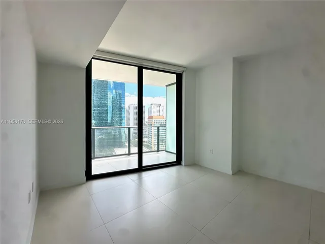 a view of a room with sliding glass door