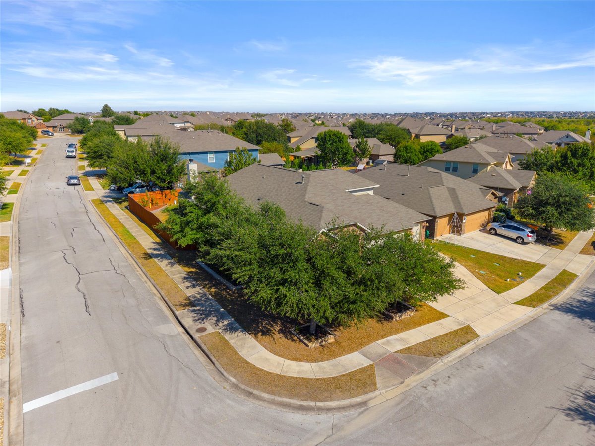 349 Razzmatazz Trail Buda, TX 78610 - Photo 6 of 40 an aerial view of a house with a garden