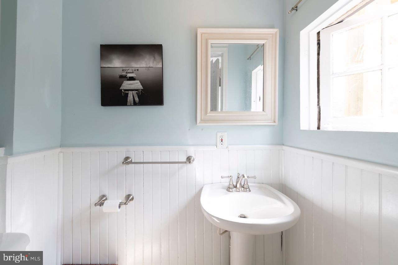 1114 County Line Road Bryn Mawr, PA 19010 - Photo 14 of 41 Powder room with wainscoting