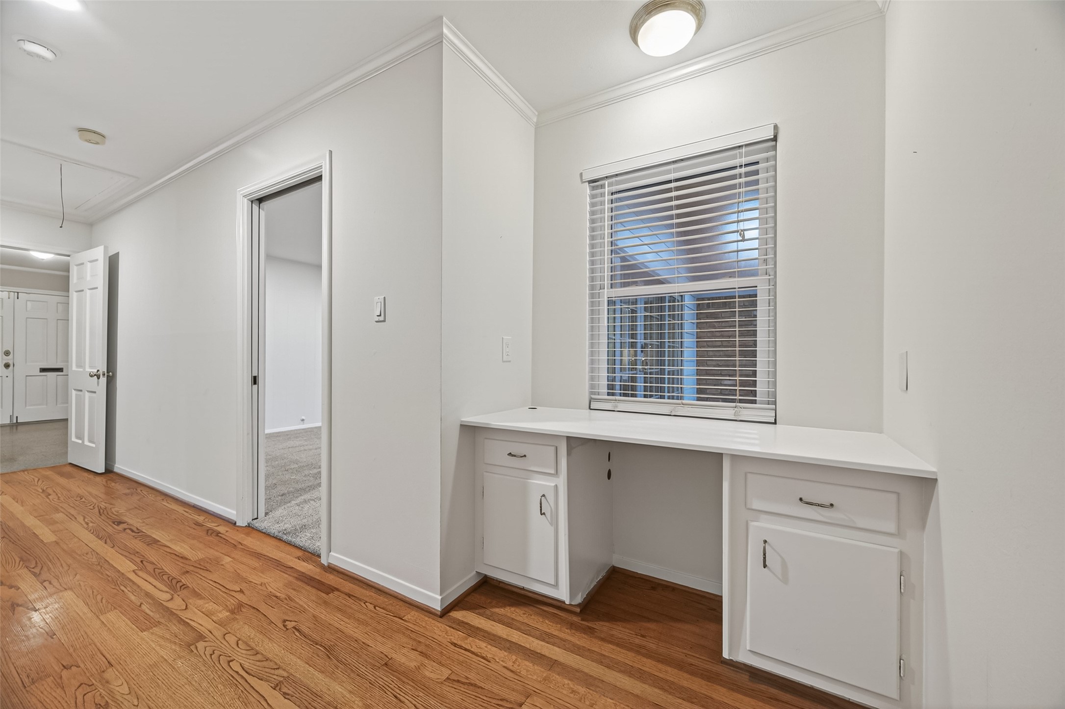 5638 Sanford Road Houston, TX 77096 - Photo 25 of 41 Versatile built-in desk area adds functionality and charm, perfect for a home office, study space or organizational hub.