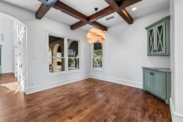 a spacious bathroom with a tub sink and mirror