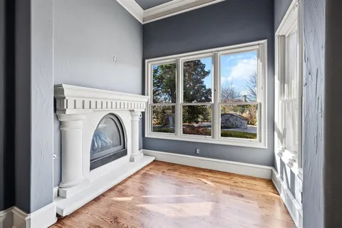 a bathroom with a large tub a sink a window and a shower