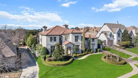 a aerial view of a house with swimming pool garden and patio