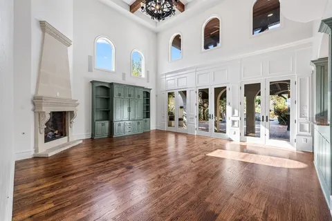 a kitchen with granite countertop a sink a counter space appliances and cabinets
