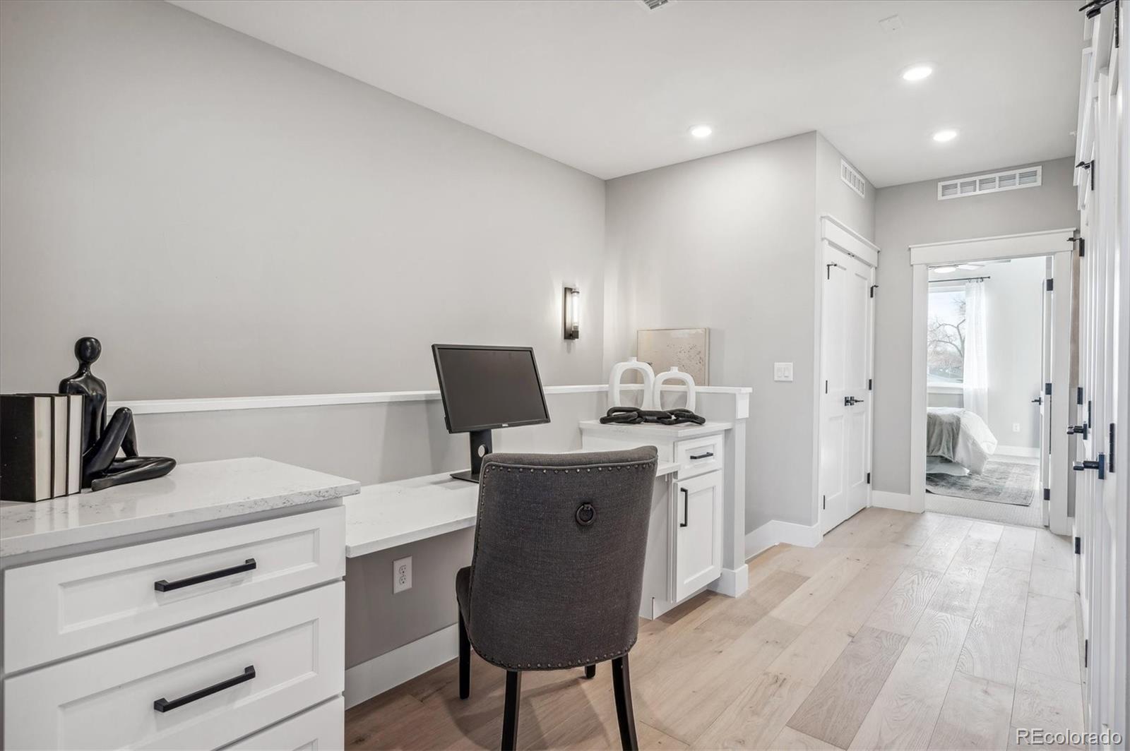 364 East Orchard Road Centennial, CO 80121 - Photo 15 of 30 a kitchen with a table chairs refrigerator and cabinets
