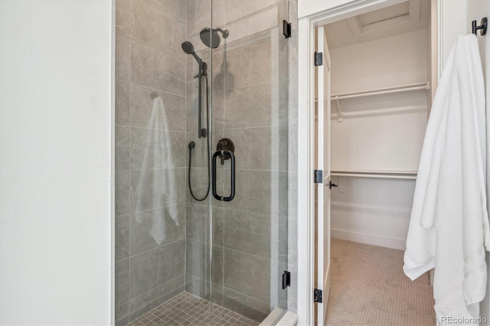364 East Orchard Road Centennial, CO 80121 - Photo 20 of 30 a bathroom with a glass shower door