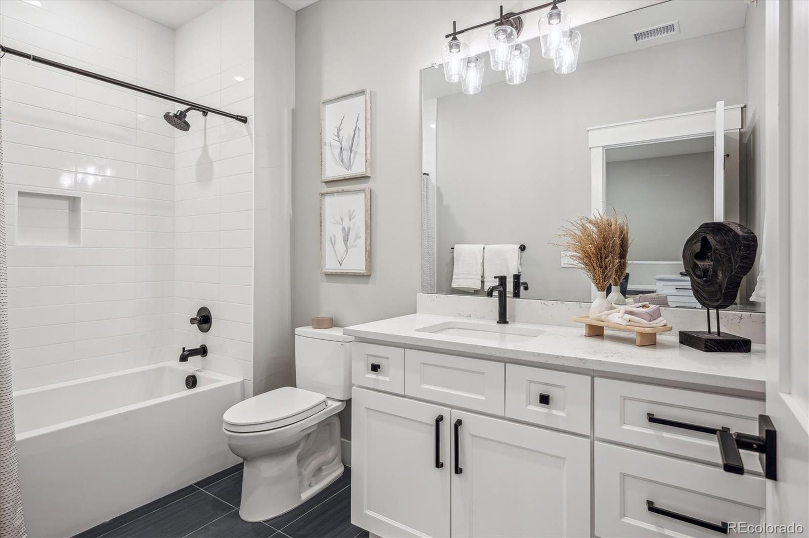 364 East Orchard Road Centennial, CO 80121 - Photo 23 of 30 a bathroom with a sink a toilet and shower