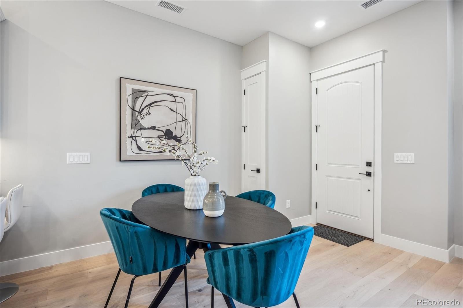 364 East Orchard Road Centennial, CO 80121 - Photo 6 of 30 a dining room with furniture and wooden floor