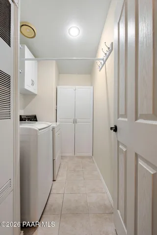 a view of hallway with cabinets