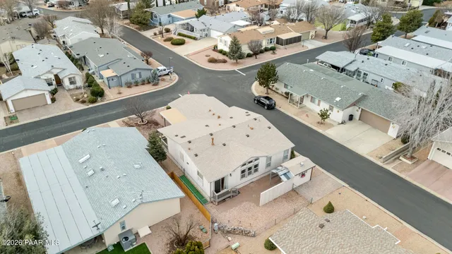 an aerial view of a house with a swimming pool