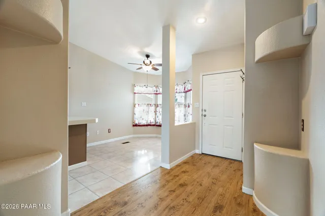 a view of a big room with windows and cabinet