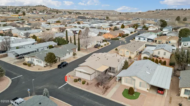 an aerial view of residential houses with outdoor space