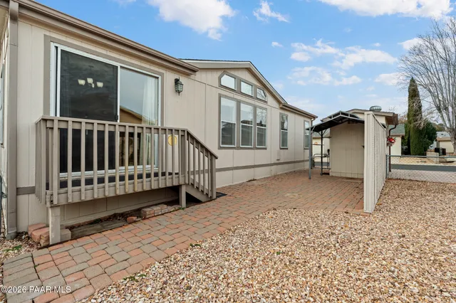 a view of a house with entertaining space and a street view