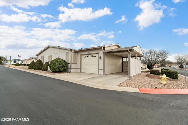 a view of a swimming pool with a yard