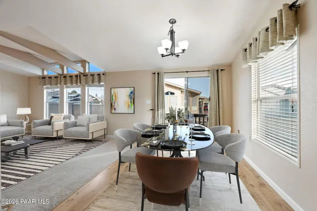 a view of a dining room with furniture window and outside view