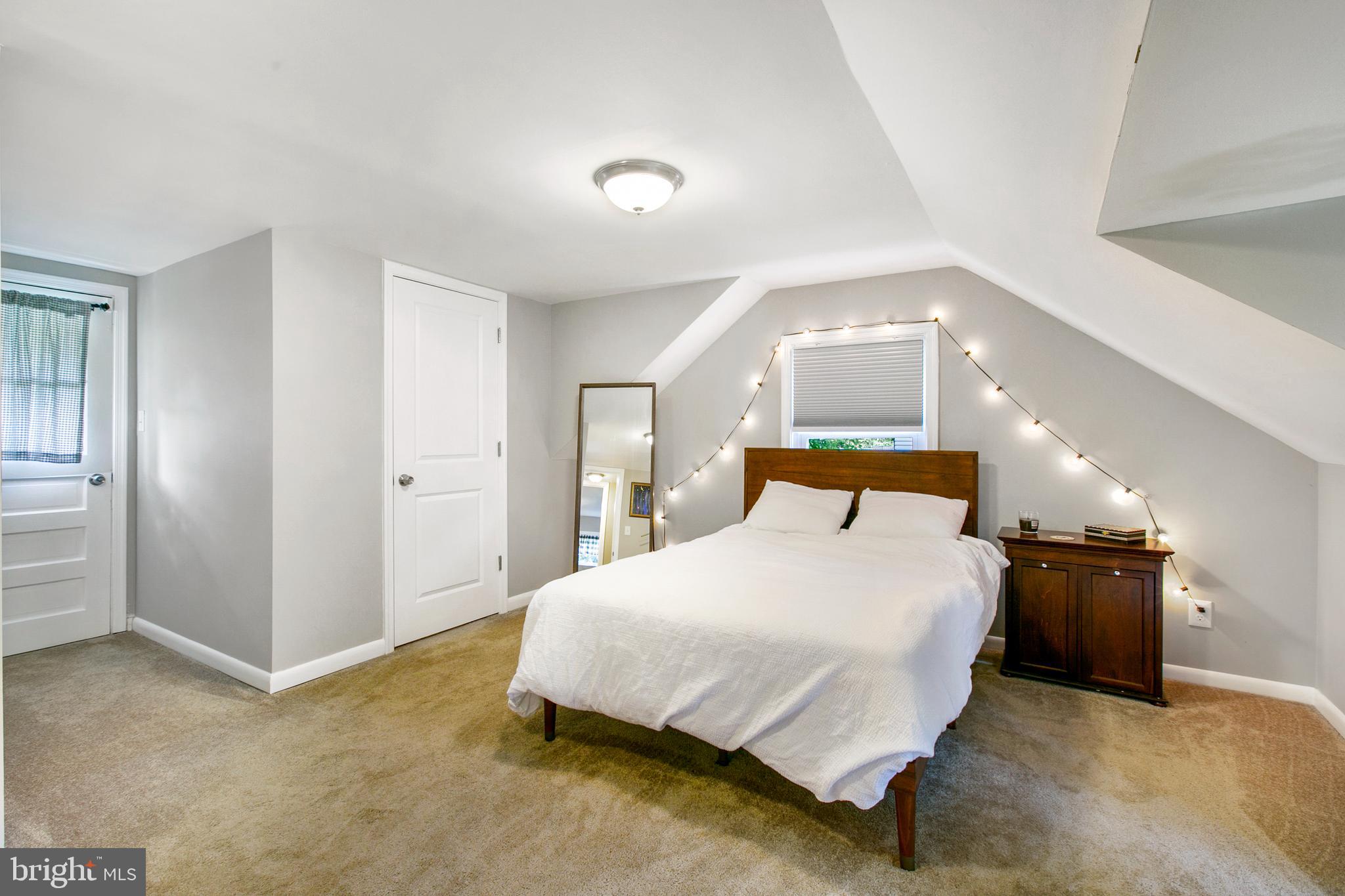 2930 Ridge Road Baltimore, MD 21244 - Photo 26 of 39 a spacious bedroom with a bed and dresser