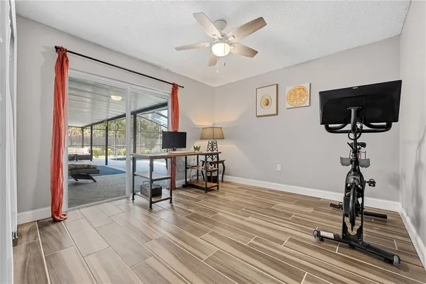 a view of a livingroom with furniture and a flat screen tv