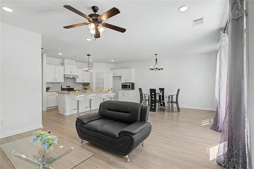 2310 Portrush Way Southeast Atlanta, GA 30339 - Photo 16 of 38 a living room with furniture and kitchen view