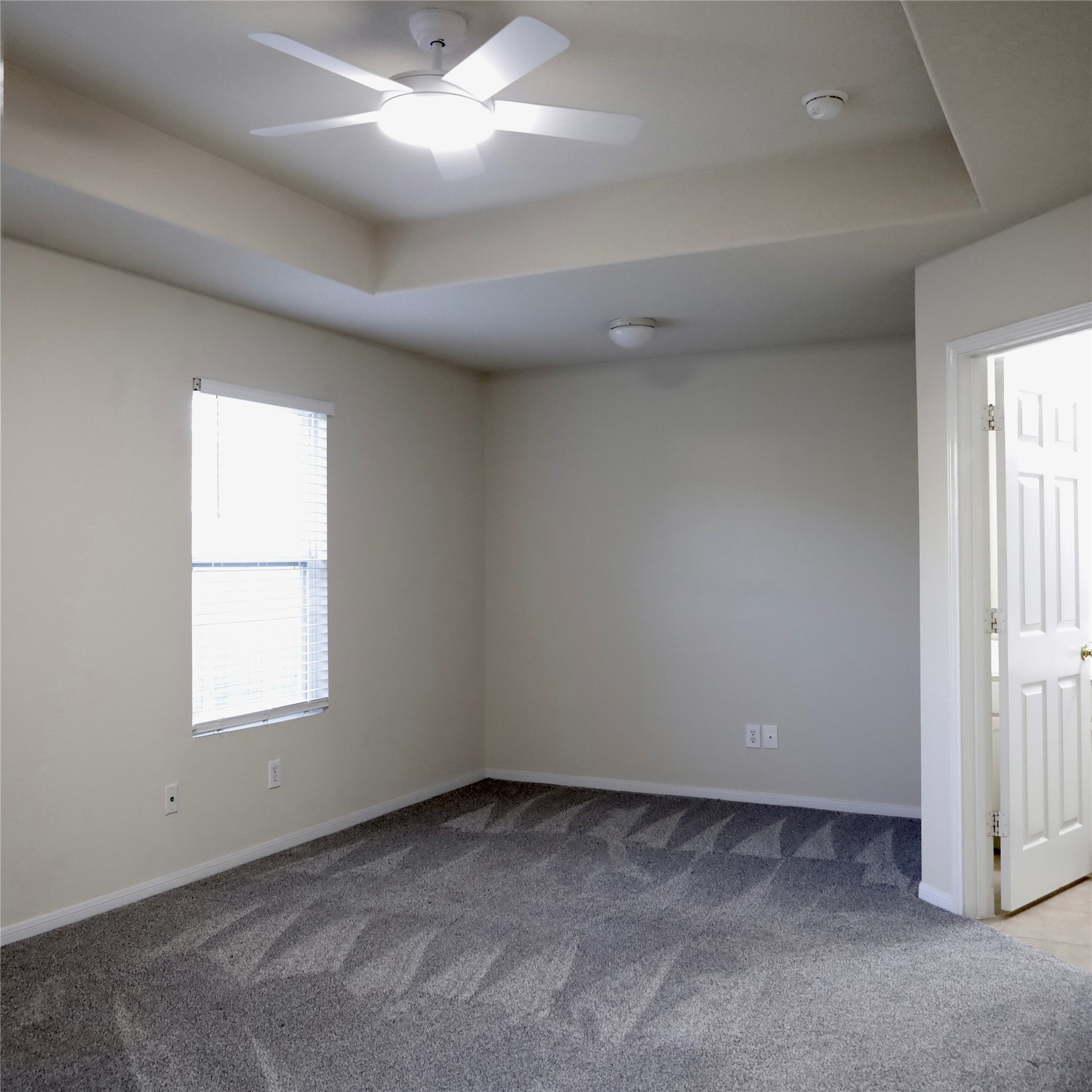 2419 Stiller Ridge Way Spring, TX 77386 - Photo 11 of 14 an empty room with windows and fan