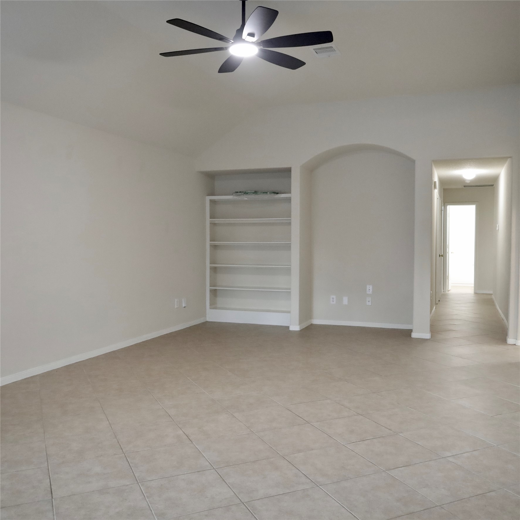 2419 Stiller Ridge Way Spring, TX 77386 - Photo 4 of 14 a view of an empty room with a ceiling fan