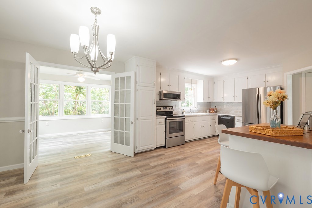 6901 Manning Road Chesterfield, VA 23832 - Photo 28 of 57 Spacious kitchen featuring white cabinetry, stainl