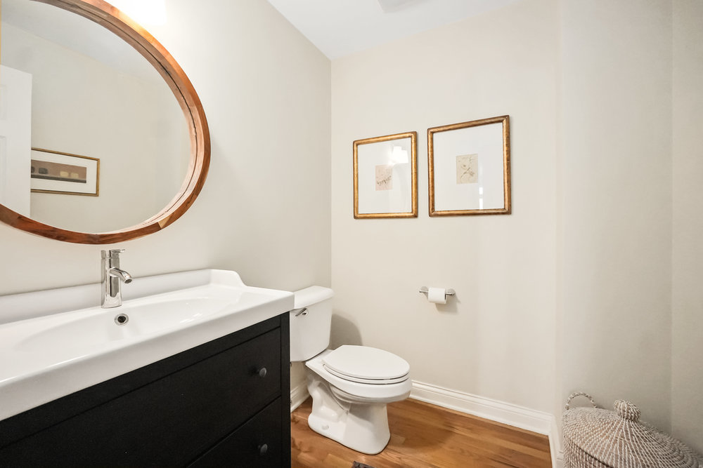 22864 Harbour Lane Plainfield, IL 60544 - Photo 15 of 65 a bathroom with a toilet a sink and mirror