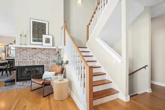 a view of a livingroom with furniture and staircase