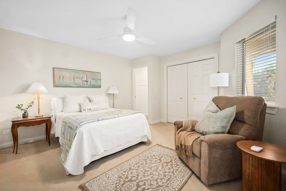 22864 Harbour Lane Plainfield, IL 60544 - Photo 23 of 65 a bedroom with furniture and a lamp