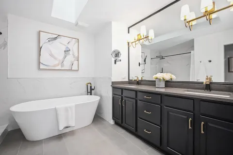 a kitchen with a sink cabinets and window