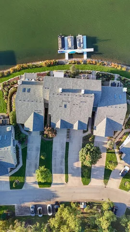an aerial view of a house with a swimming pool