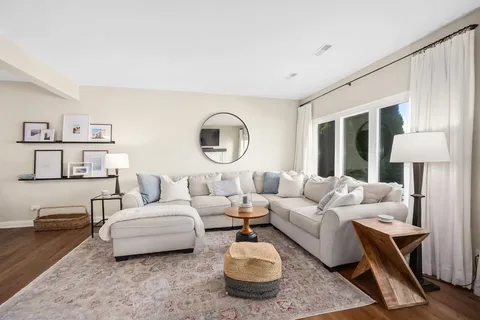 a bedroom with a bed and a couch