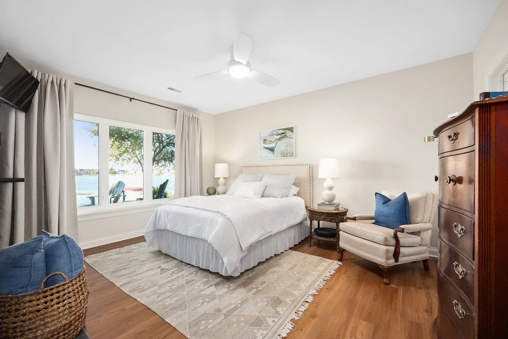 22864 Harbour Lane Plainfield, IL 60544 - Photo 36 of 65 a bedroom with a bed and a couch