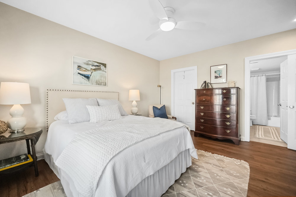 22864 Harbour Lane Plainfield, IL 60544 - Photo 37 of 65 a bedroom with a bed and wooden floor