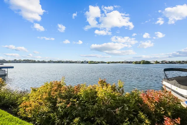 an aerial view of a house with a lake view
