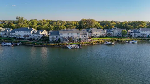 a view of houses with outdoor space and lake view