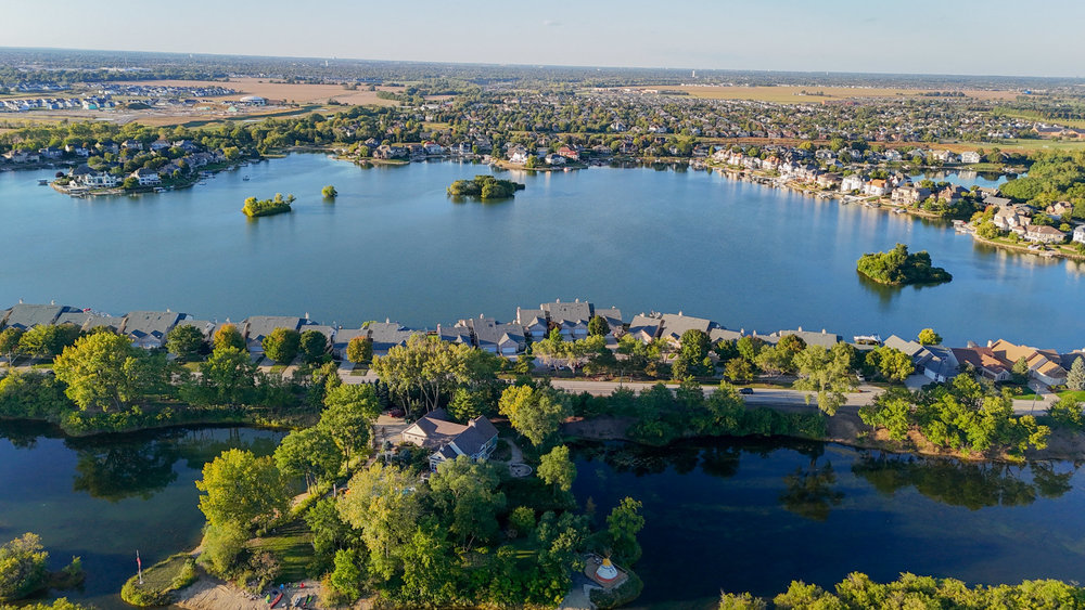 22864 Harbour Lane Plainfield, IL 60544 - Photo 47 of 65 an aerial view of a house with a lake view