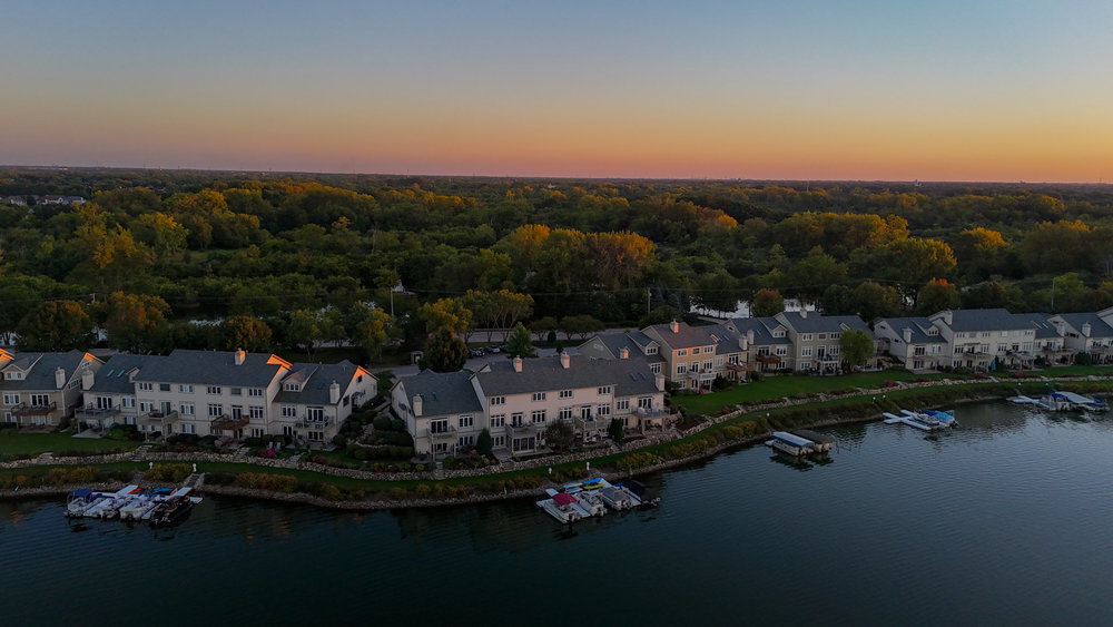 22864 Harbour Lane Plainfield, IL 60544 - Photo 56 of 65 a view of a lake with houses in back