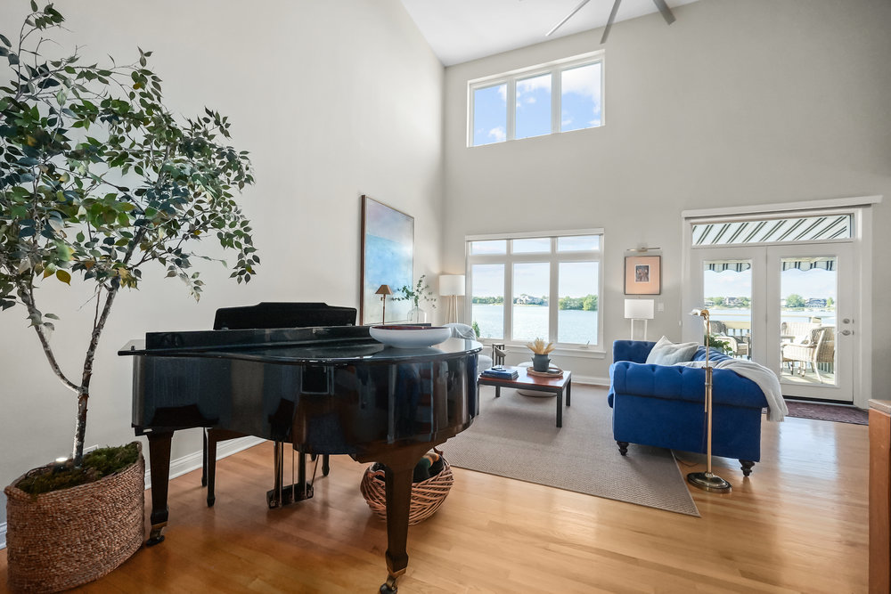 22864 Harbour Lane Plainfield, IL 60544 - Photo 6 of 65 a living room with furniture and a floor to ceiling window