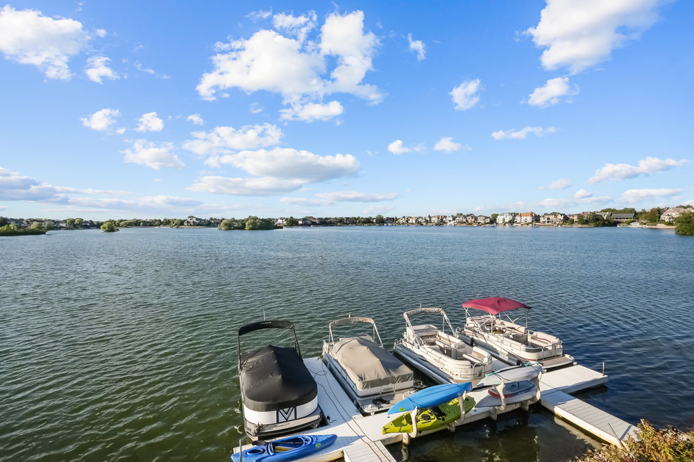 22864 Harbour Lane Plainfield, IL 60544 - Photo 61 of 65 a view of a lake with sitting space