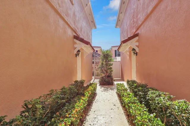 a view of a pathway with house on both side