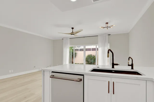 a kitchen with a sink and a window