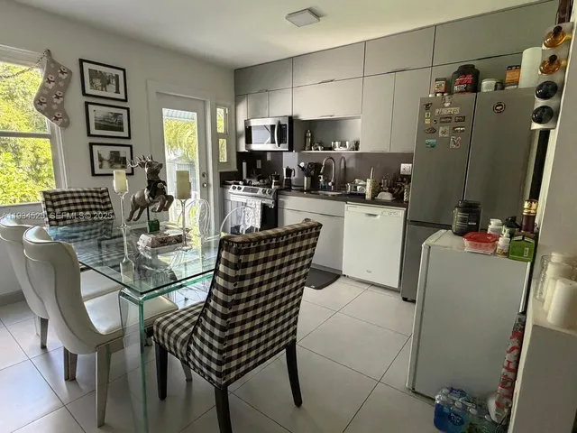 a view of a hallway with washer and dryer
