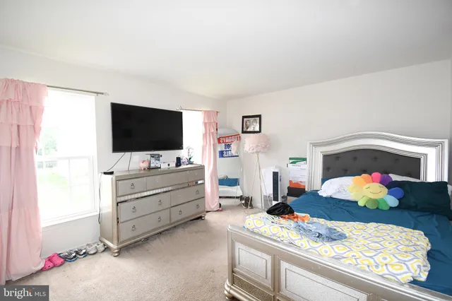 a room with furniture and flat screen tv