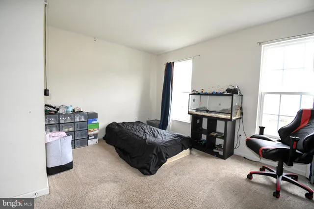 a bedroom with a workspace