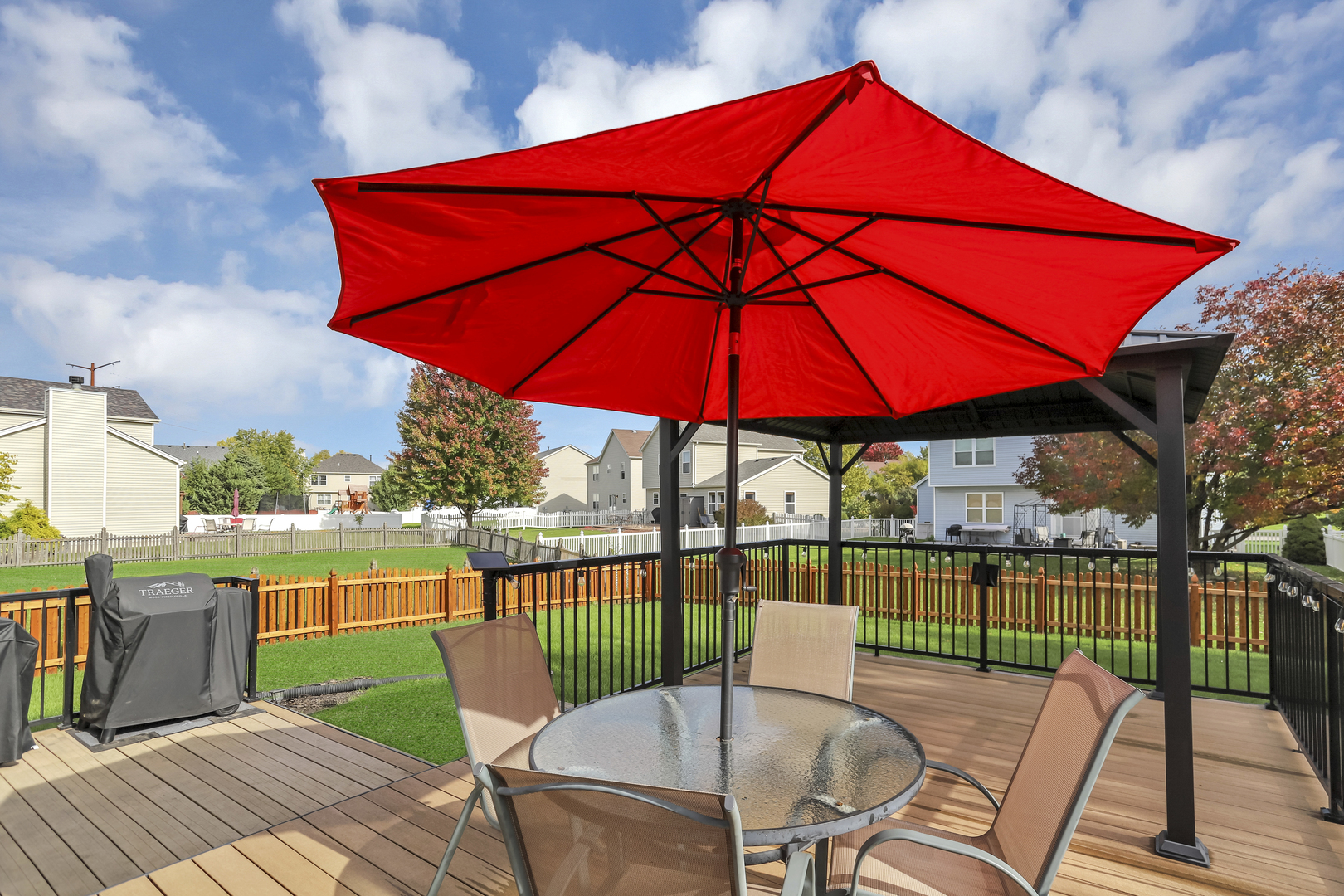 1908 Prairie Ridge Drive Plainfield, IL 60586 - Photo 13 of 34 a view of a chairs and table on the deck