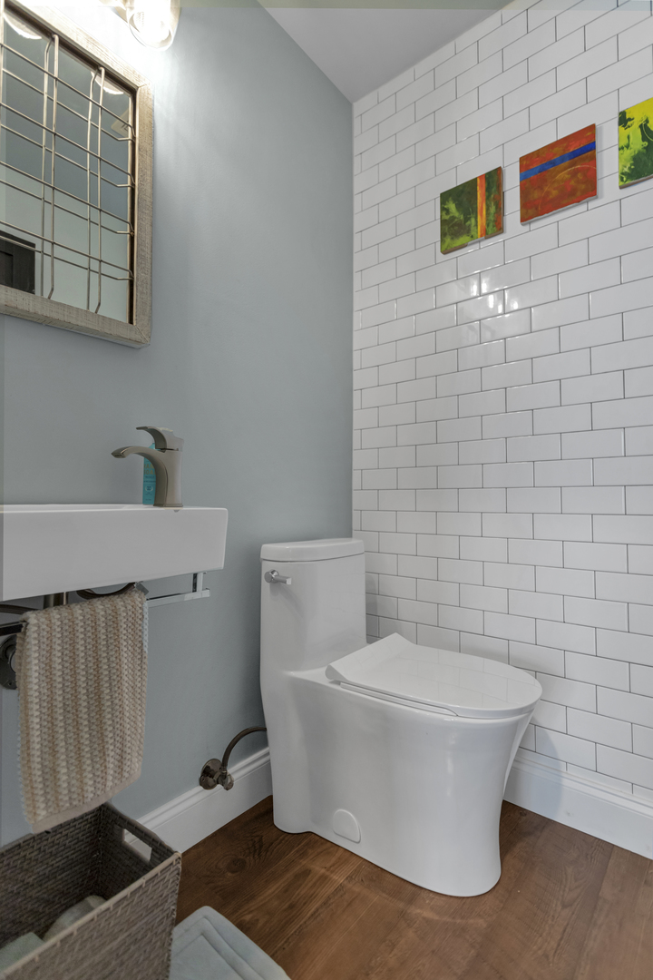 1908 Prairie Ridge Drive Plainfield, IL 60586 - Photo 14 of 34 a white toilet sitting next to a bathroom sink